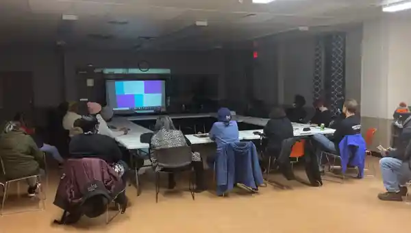 Group of people watching presentation