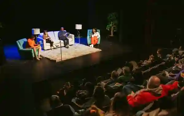 Panel discussion on stage with audience